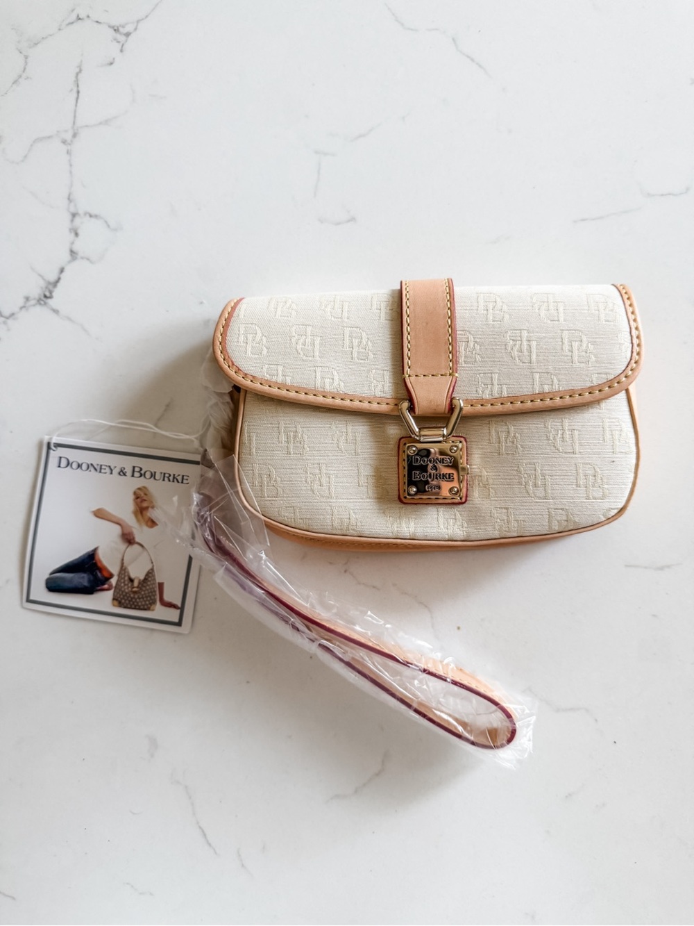NWT Dooney & Bourke Ivory Logo Flap Wristlet